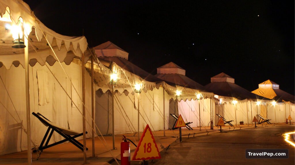 Rann Utsav 2026-27 at Dhordo: Dates, Tent City, Permit, and the Best Nights to Go 20 Lit tent porches at the Rann Utsav Tent City at night