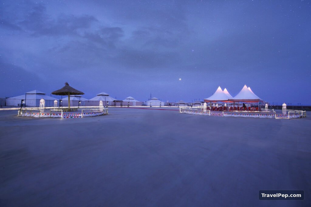 Rann Utsav 2026-27 at Dhordo: Dates, Tent City, Permit, and the Best Nights to Go 17 Rann Utsav Tent City tents on the salt flats in blue-hour light