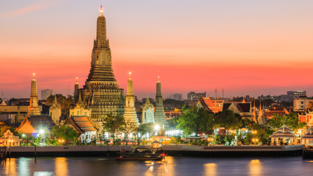Thailand Visa for Indians: The 30-Day Rule, TDAC, and Longer Stays 14 Wat Arun in Bangkok at sunset, seen across the Chao Phraya River